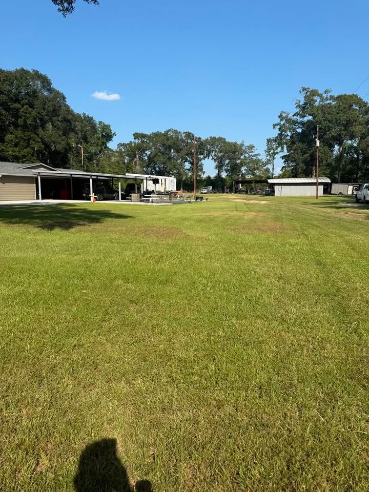 Large rural property with wide mowed lawn